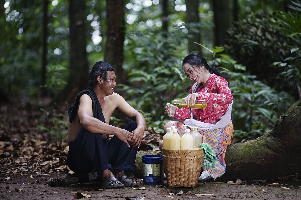 A jamu seller with a customer.