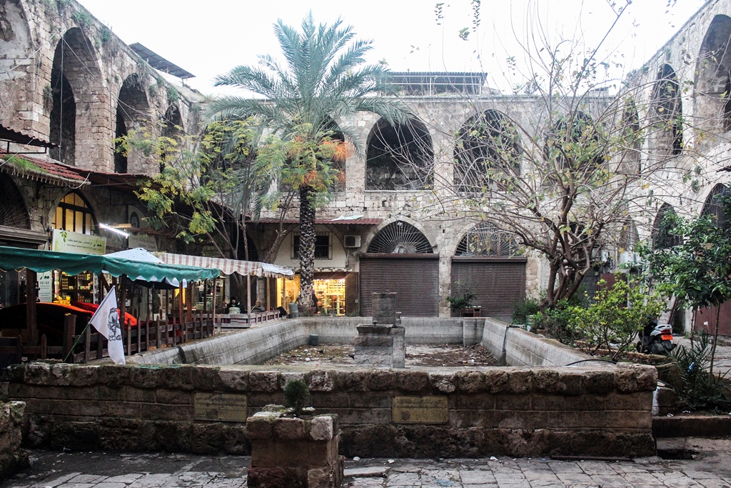 Stone courtyard and shopfronts in Tripoli's Soap Khan.
